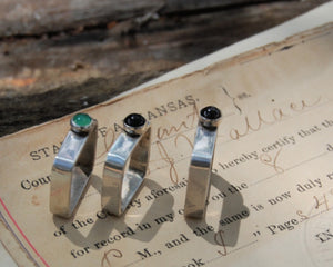 Three sterling silver square rings each with a single off centered stone by kbeau jewelry