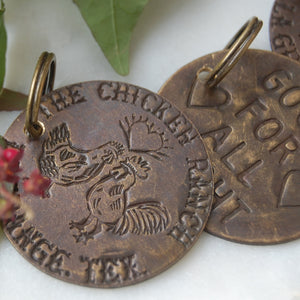 Replica of chicken ranch brothel tokens made into keychains by kbeau jewelry
