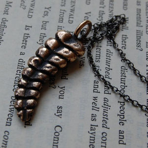 Bronze rattlesnake rattle on dark silver chain