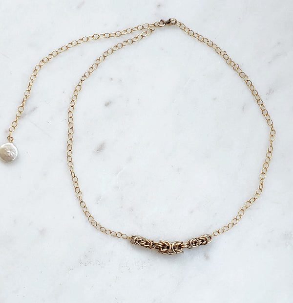 gold necklace with pearl accent