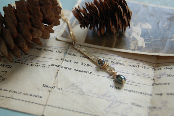 Sterling silver stick wire wrapped in gold-fill with grey pearls as accents